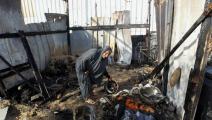 مسنة تتفدق ملجأ محترق جراء قصف إسرائيلي على مخيم نازحين في رفح/19 يونيو 2024 (Getty)