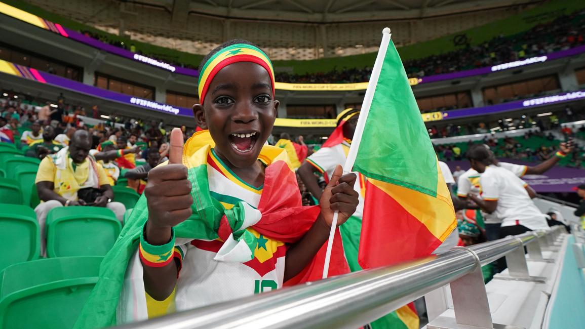 احتفل مشجعو السنغال الشباب بمباراة السنغال وهولندا (فلورنسيا تان جون/Getty)