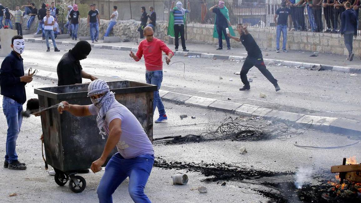 فلسطينيون خلال مواجهات مع جيش الاحتلال الإسرائيلي في الضفة