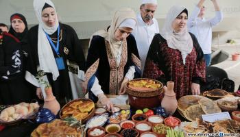 مهرجان سفرة للاحتفال بالمأكولات التراثية الفلسطينية في غزة / عبد الحكيم أبو رياش / العربي الجديد