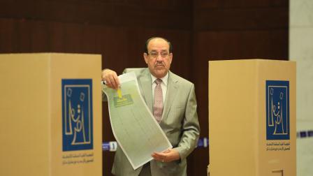 المالكي خلال الانتخابات النيابية ببغداد، 12 مايو 2018 (مرتضى السوداني/الأناضول)